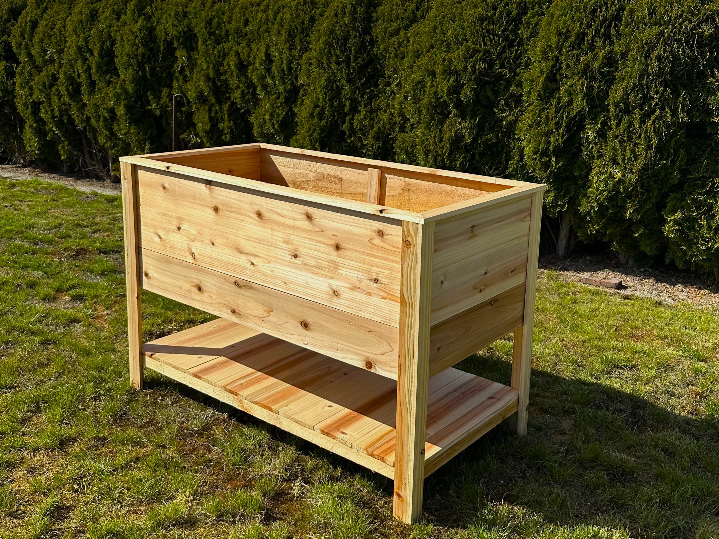 4' × 2' cedar raised bed, 16" deep with waist-height bench — angled view